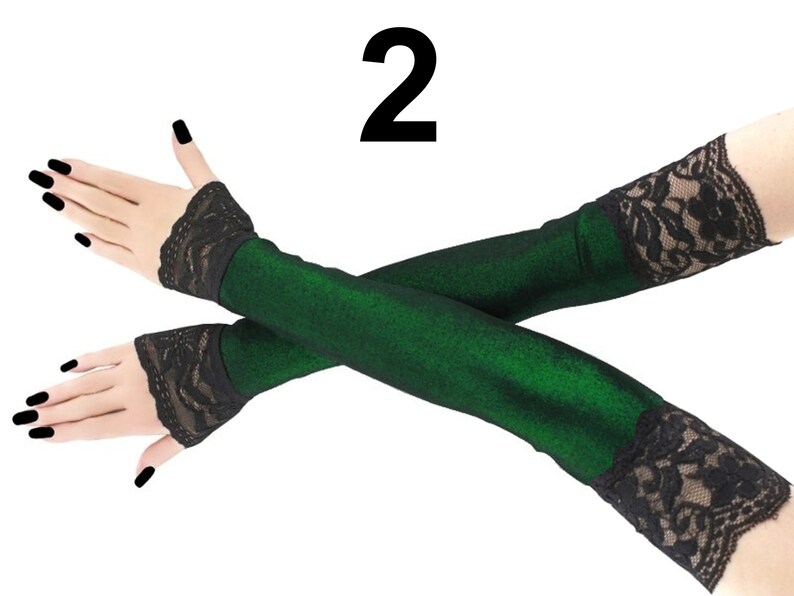 These extra long fingerless gloves are the epitome of style and sophistication. Crafted with meticulous attention to detail, they feature a stunning front piping in a mesmerizing lurex green and black design.