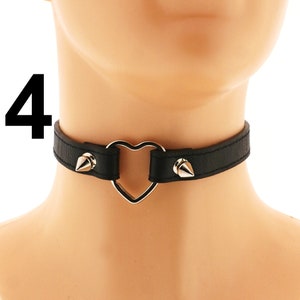 This vegan leather choker is ideal for fans of punk or rock fashion. With its heart ring, spiked design, and adjustable buckle closure, all in a striking all-black color, it brings a rebellious touch to any ensemble.