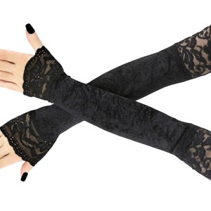 Discover our collection of elegant velvet all black fingerless gloves. These extra long gloves are perfect for evening wear, extending up the arm and featuring stylish front piping.