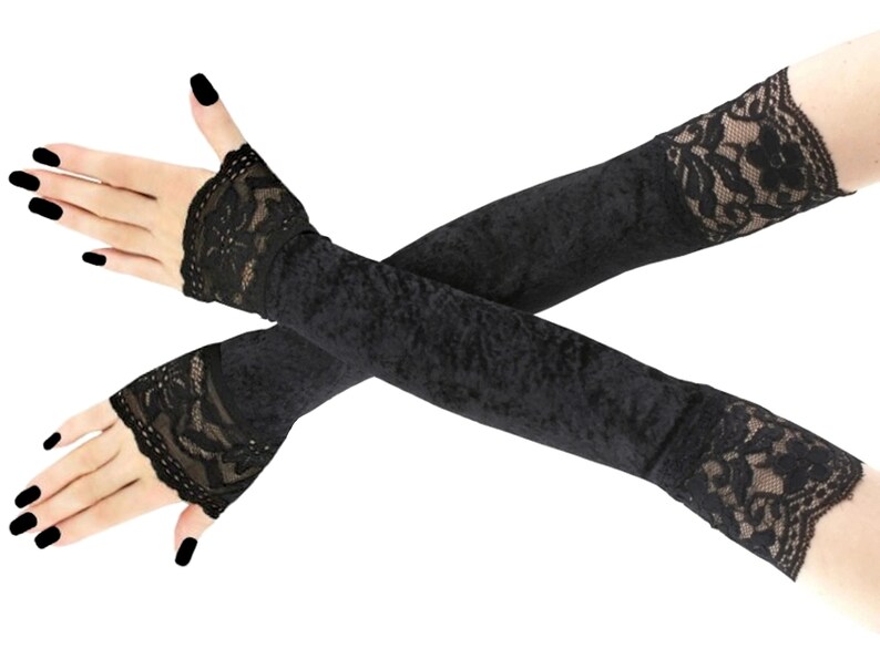 Discover our collection of elegant velvet all black fingerless gloves. These extra long gloves are perfect for evening wear, extending up the arm and featuring stylish front piping.