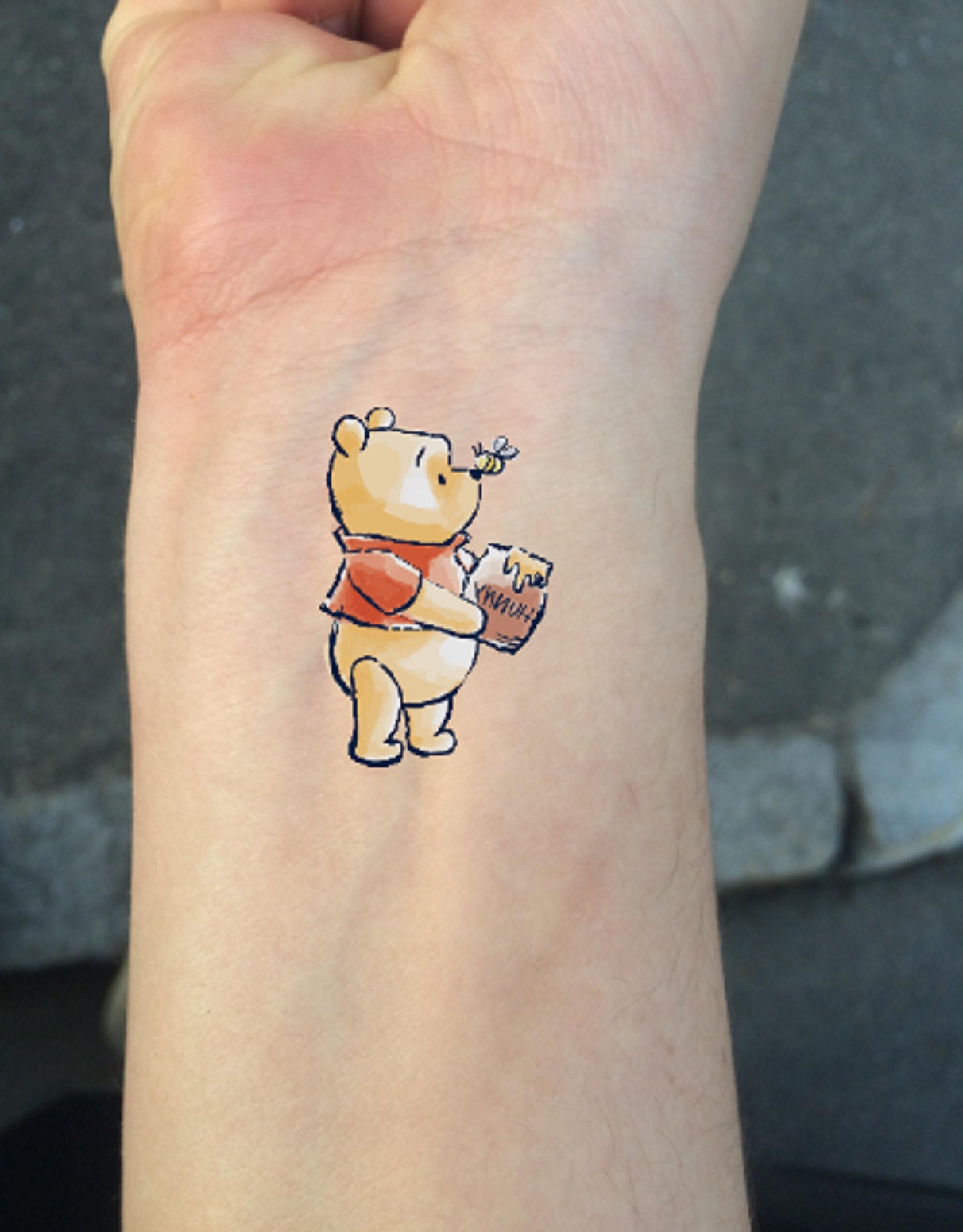 Winnie Pooh Flying With balloons Tattoo On Ankle