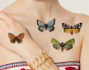 May include: Four temporary butterfly tattoos on a person's skin. The tattoos are in various colors, including blue, orange, yellow, and green.