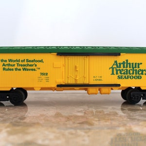 May include: A yellow and green toy train car with the words "Arthur Treacher's Seafood" and "In the World of Seafood, Arthur Treacher's Rules the Waves." printed on the side.
