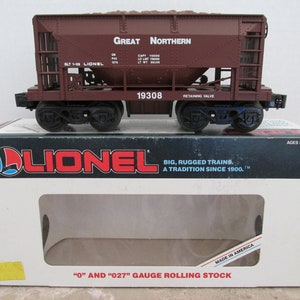 May include: A brown Lionel model train car with the words "Great Northern" and "BLT 1-83 Lionel" printed on the side. The car has a number "19308" printed on the side. The car is in a white box with the Lionel logo and the words "Big, Rugged Trains. A Tradition Since 1900." printed on the side.