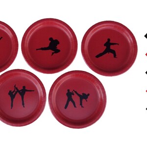 May include: Set of six red paper plates with black silhouettes of martial arts figures. The plates are 9 inches in diameter. Also included are five black napkins with red accents.