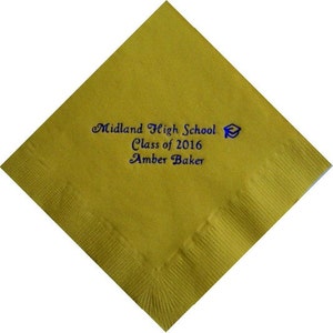 May include: A square, golden-yellow paper napkin with a decorative border. The napkin features blue text that reads "Midland High School Class of 2016 Amber Baker" and a graduation cap graphic.