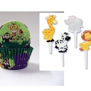 May include: Green and purple cupcake liners with a jungle animal print. The liners feature a monkey, giraffe, crocodile, and bird. There are also five cupcake toppers with jungle animals: a giraffe, elephant, zebra, lion, and rhino.