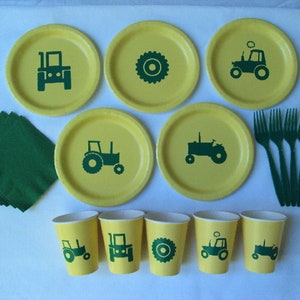 May include: A set of green and yellow tractor themed party supplies. The set includes plates, cups, napkins, and forks. The plates and cups feature a green tractor silhouette. The napkins are green and the forks are green.
