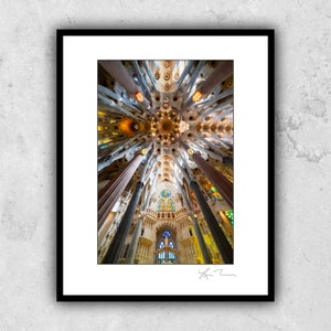 May include: A view of the interior of a cathedral with a high vaulted ceiling and many pillars. The ceiling is decorated with intricate patterns and stained glass windows.