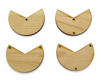 May include: Four unfinished wooden half-circle shapes with a pointed edge. Each shape has two holes near the pointed edge.