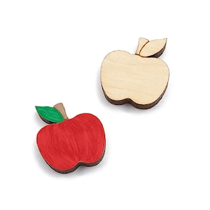 May include: Two wooden apple shapes, one painted red and one left natural wood.