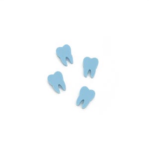 May include: Four light blue tooth-shaped objects are scattered on a white background. Each tooth has a curved root and a slightly darker blue shade in the crevices, creating a subtle contrast. The objects are evenly spaced.