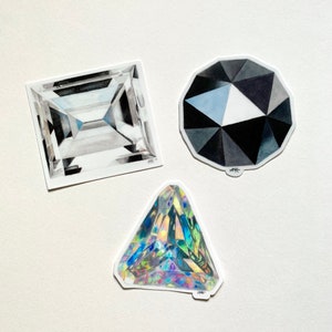 May include: Three hand-drawn illustrations of different gemstones. The first is a square-shaped diamond with a clear, faceted design. The second is a round, black diamond with a faceted design. The third is a triangular, iridescent gemstone with a faceted design.
