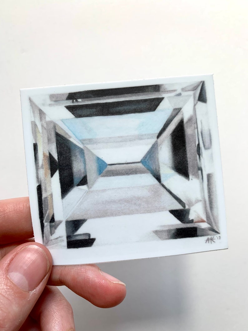 May include: A drawing of a square-shaped diamond with many facets. The diamond is drawn in shades of gray and white, with a hint of blue in the center. The drawing is signed "AK '17" in the bottom right corner.