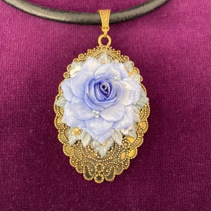 Blue store rose pendant