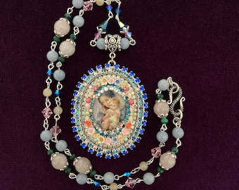 Mother Mary and the baby Jesus Cameo Shrine Locket.