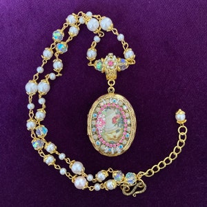 White Kitten Rosebuds Cameo Locket, Winking Cat in a WhiteTop Hat Necklace.