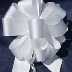 May include: A large white satin bow with long tails. The bow is tied in a classic style with multiple loops and is perfect for adding a touch of elegance to any gift or occasion.