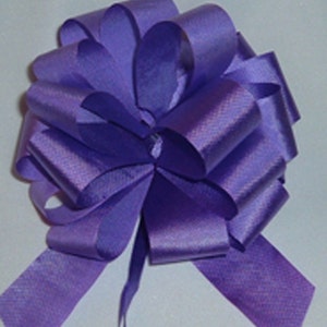 May include: A purple satin bow with a long tail. The bow is made of multiple layers of ribbon and is tied in a classic bow shape.