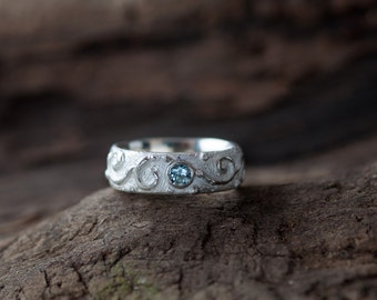 dreamlike beautiful ring with spiral ornaments set with an bright blue Topas -   handcrafted single work with love in silver 925 sterling