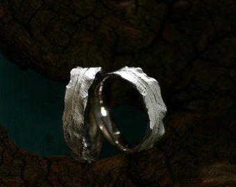 A pair of beautiful wedding rings in shape of fern leafs