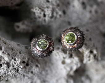 a pair of handcrafed earring studs in form of acorns -  set with peridot in silver 925