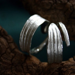 Pair of wedding rings in form of a ribwort meadow herb