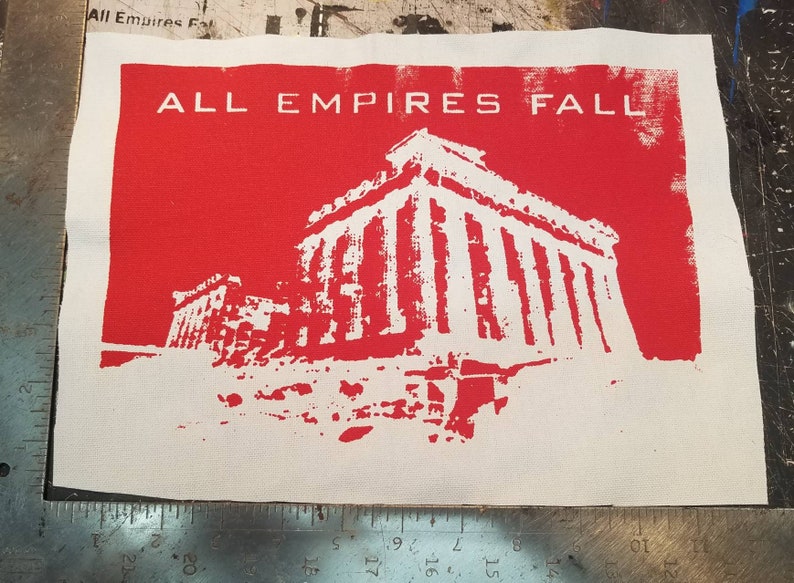 May include: A white patch with red background featuring a white silhouette of a building with columns and the text "ALL EMPIRES FALL" in white.