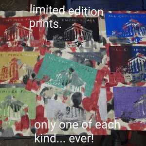 May include: Nine limited edition prints of a building with the text "All Empires Fall" in different colors. The prints are on a red, white, and black patterned fabric. The text "limited edition prints" and "only one of each kind... ever!" is also visible.