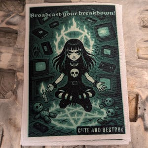 May include: A rectangular patch with a dark teal illustration. The image features a gothic girl with long black hair, a skull pendant, and the text "Broadcast your breakdown!" and "Cute and Destroy". The girl is surrounded by televisions, a pentagram, and skulls.