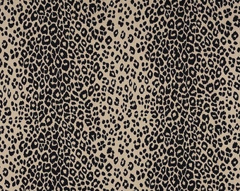 May include: A tan fabric with a repeating pattern of black leopard spots. The spots vary in size and shape, creating a textured, animal print design. The fabric has a neutral color palette, suitable for various applications.