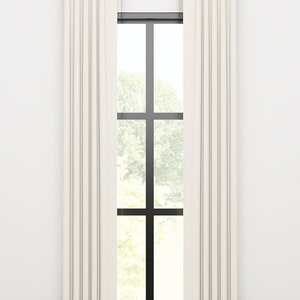 May include: A pair of white linen curtains with a rod and finials hanging in front of a window with a view of trees.