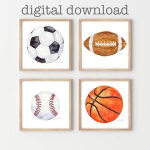 May include: Set of four watercolor illustrations of sports balls: a soccer ball, a football, a baseball, and a basketball. Each ball is depicted in a realistic style with subtle watercolor washes.
