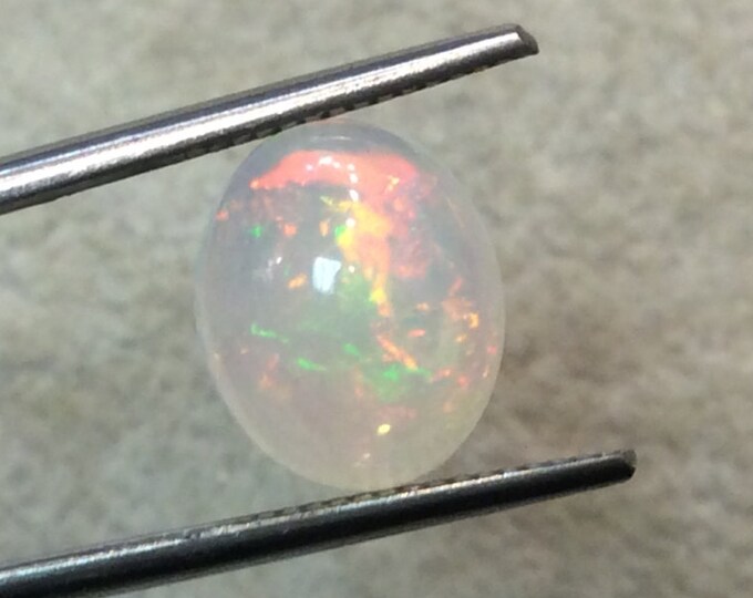 Natural Ethiopian Opal Smooth Oval Shaped Flat Back Cabochon 'I' - Measuring 10mm x 12mm, 5mm Dome Height - High Quality Gemstone Cab