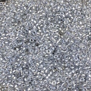 Perline di vetro Miyuki color cristallo con finitura lucida e foderate in peltro, taglia 11/0 - vendute in tubi da 23 grammi (~ 2500 perline/tubo) - (11-9242)