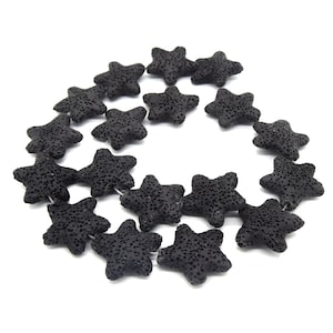 May include: A strand of black lava rock beads in the shape of stars.