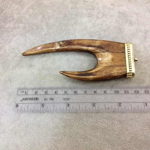 Measuring 45mm x 70mm TR275WBNFA Approximately - 2.75 Warm Brown Notched Arrow Shaped Natural Ox Bone Pendant with Dotted Gold Cap