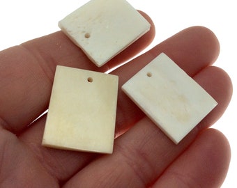 Rechthoekige hanger ossenbot: witte sieradenvondst (paar (paar) van 19 mm x 23 mm)
