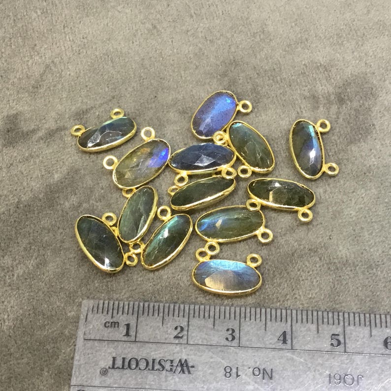 Gold Plated Copper Faceted Natural Labradorite Faceted Oval Shaped Bezel Pendant with Two Top Rings Measuring 14mm x 7mm