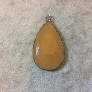Gunmetal Finish Faceted Light Orange Chalcedony Teardrop Shaped Bezel Pendant - Measuring 28mm x 47mm - Natural Semi-precious Gemstone