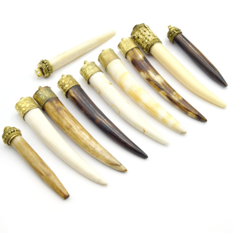 Ox bone focal pendants for jewelry making. These natural shaped pendants feature intricate lines and patterns, perfect for adding an earthy and rustic feel to your handmade jewelry