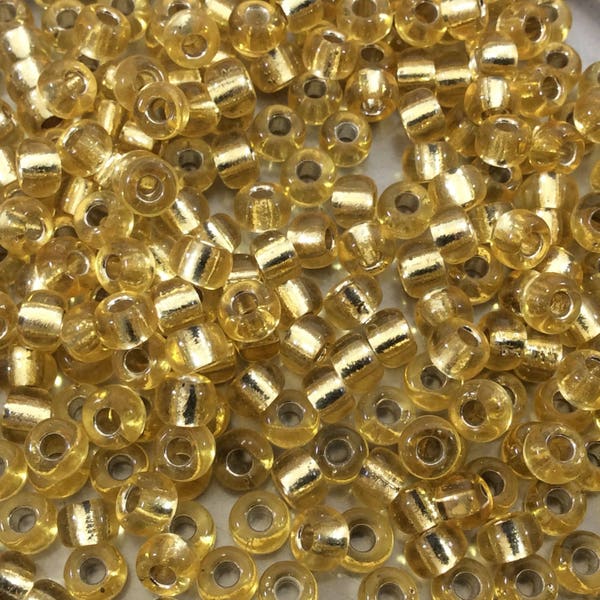 Size 6/0 Glossy Finish Silver Lined Light Gold Genuine Miyuki Glass Seed Beads - Sold by 20 Gram Tubes (Approx. 200 Beads/Tube) - (6-9002)