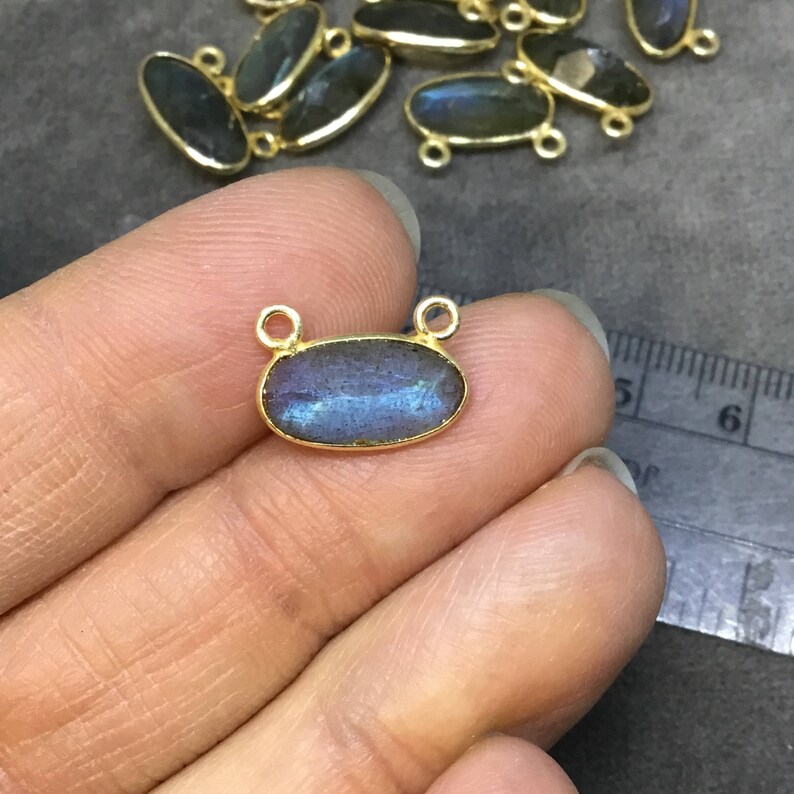 Gold Plated Copper Faceted Natural Labradorite Faceted Oval Shaped Bezel Pendant with Two Top Rings Measuring 14mm x 7mm