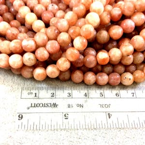 Natural Sunstone Gemstone Beads - Smooth Round, 8-9mm, Glittery Peach/Orange, 15.5&quot; Strand (~48 Beads)