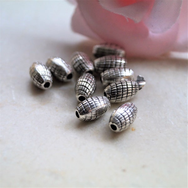 Perles en métal ovales rayées argentées 9*6 mm