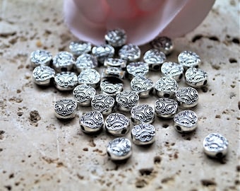 Flat engraved flower beads in silver metal 6 mm