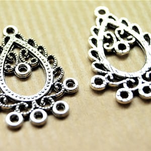 Łączniki kroplowe srebrne 29*22 mm z 6 kółkami montażowymi