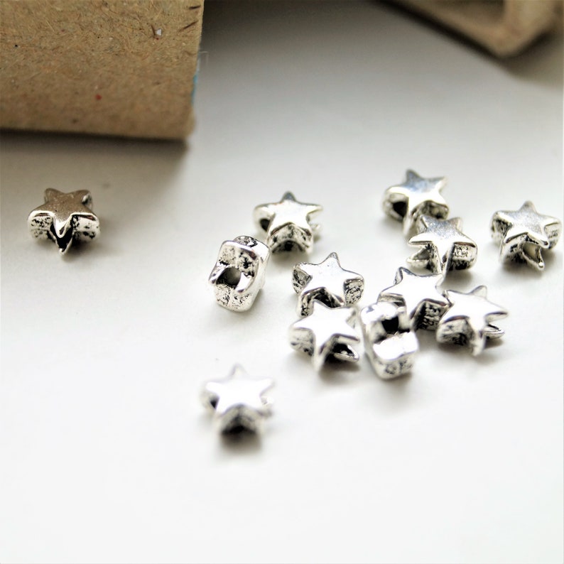 Perles étoiles en métal argenté 66 mm 10 Perles