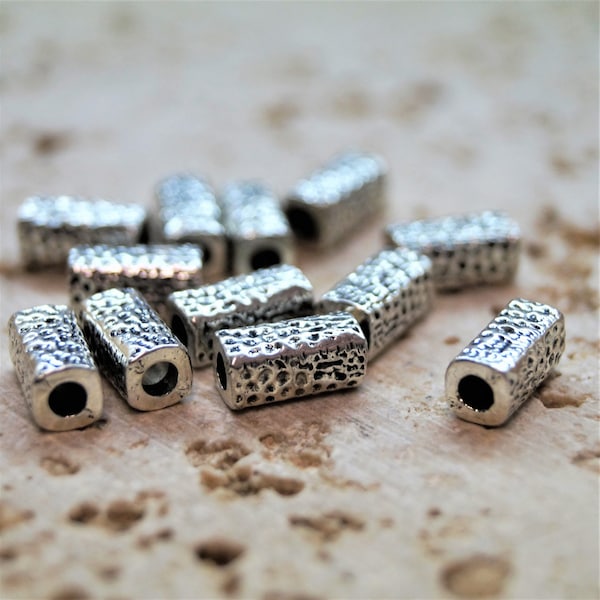 Perles tubes rayés argenté 10*5 mm