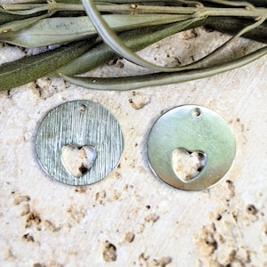 Round sequins with hollow heart silver metal 20 mm